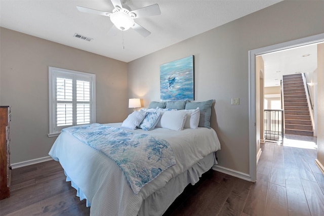 151 Bamaku Bnd, Tiki Island, TX 77554 - bedroom featuring dark wood-style floors, baseboards, and ceiling fan