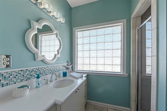 bathroom featuring vanity, tile patterned floors, and a shower with door