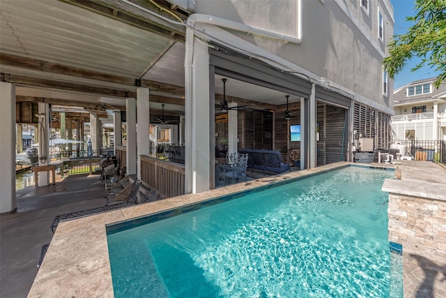151 Bamaku Bnd, Tiki Island, TX 77554 - swimming pool featuring a patio area and a ceiling fan