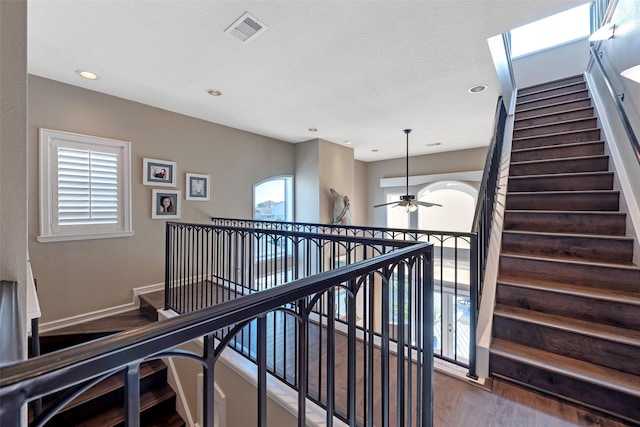 151 Bamaku Bnd, Tiki Island, TX 77554 - staircase with ceiling fan, wood finished floors, recessed lighting, and baseboards