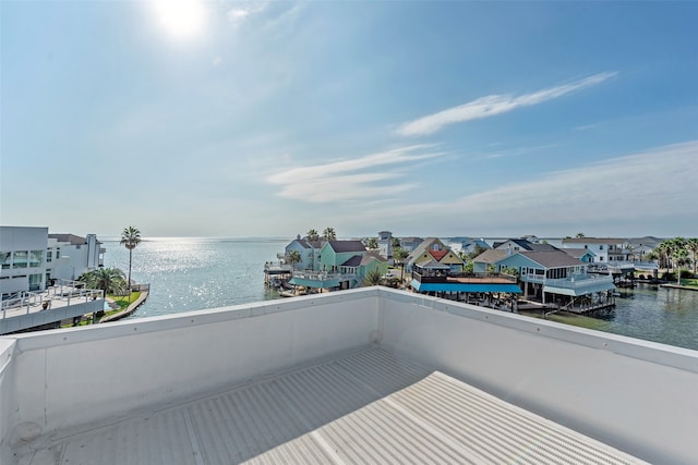 balcony featuring a water view