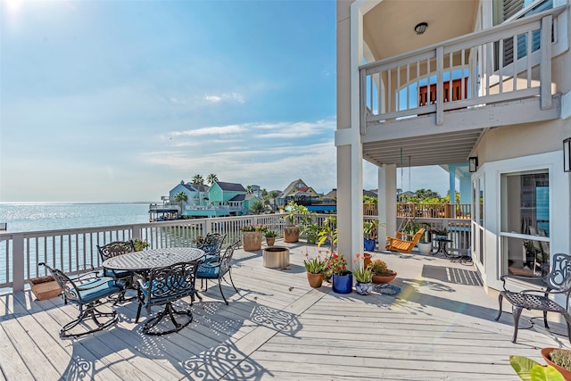 wooden deck featuring a water view