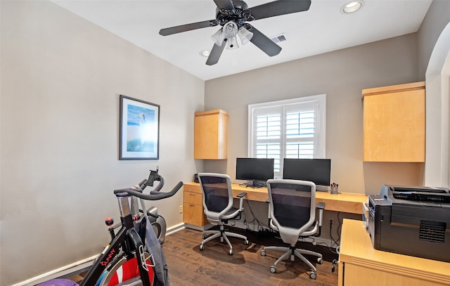 office with ceiling fan and dark wood-type flooring