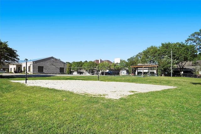 surrounding community featuring volleyball court, a lawn, and a gazebo