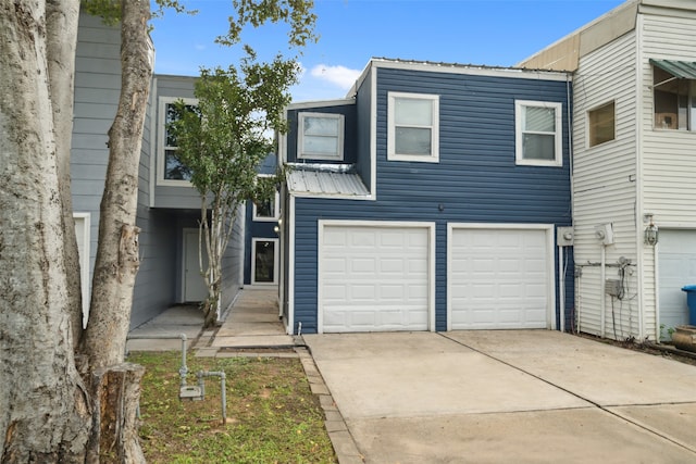 townhome / multi-family property featuring a garage