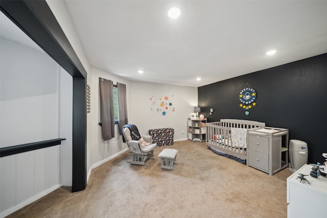 carpeted bedroom with a crib