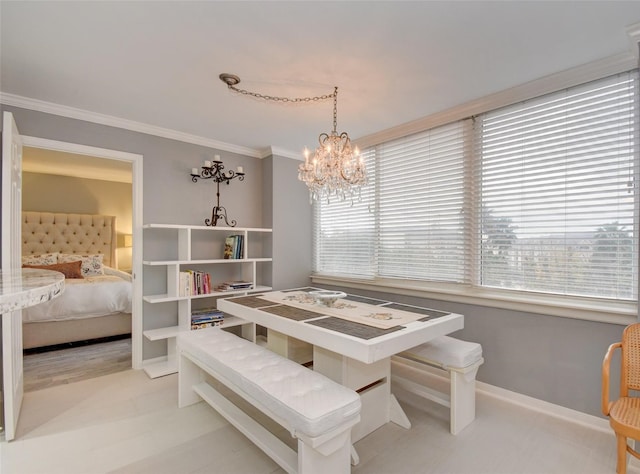 dining area with a notable chandelier and ornamental molding