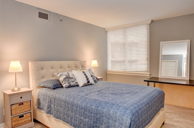 bedroom with light hardwood / wood-style floors