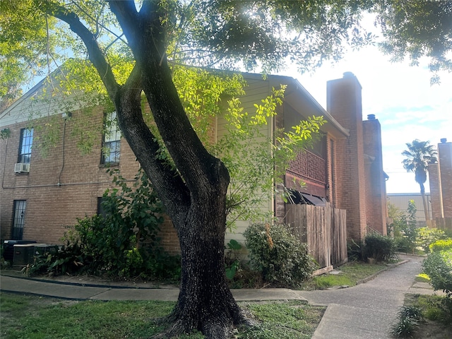 view of property exterior with cooling unit and central AC unit