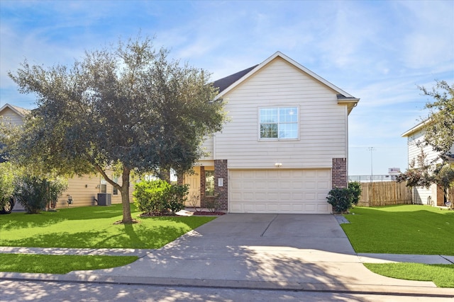 view of front of home with central air condition unit, a front lawn, and a garage