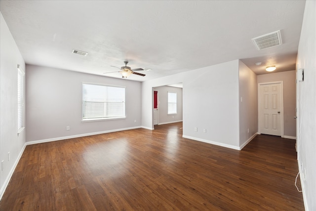 unfurnished room with ceiling fan and dark hardwood / wood-style floors