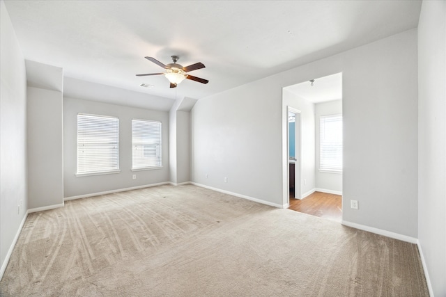 carpeted empty room with ceiling fan