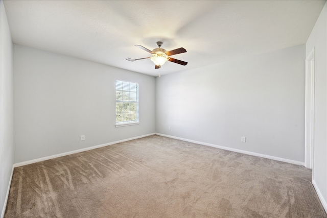 unfurnished room featuring carpet and ceiling fan