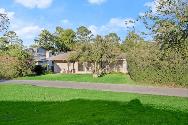 view of community featuring a yard