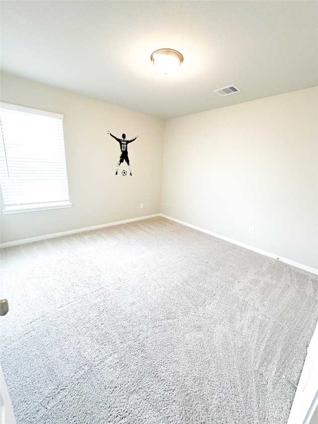 empty room featuring carpet floors