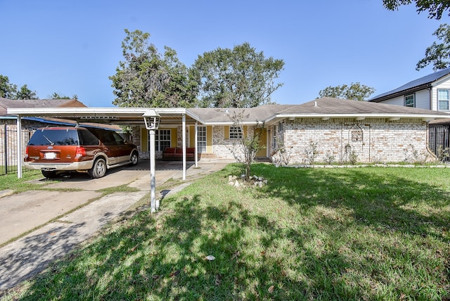 ranch-style house with a front yard and a carport