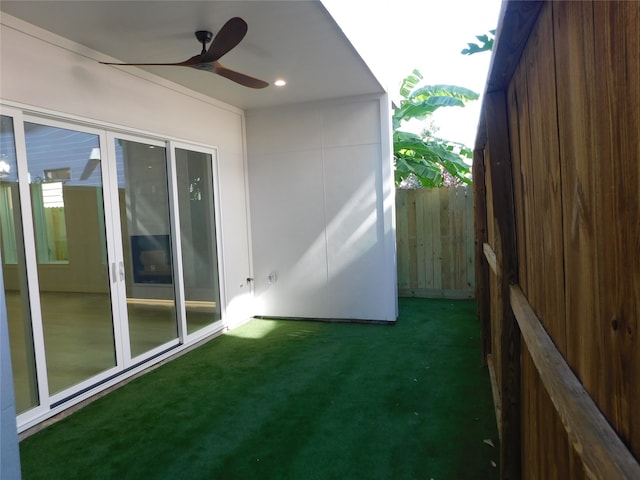 exterior space with ceiling fan