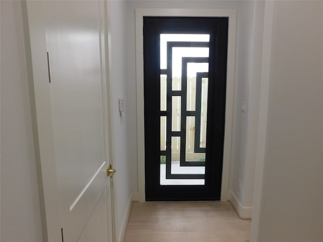 doorway with light hardwood / wood-style floors