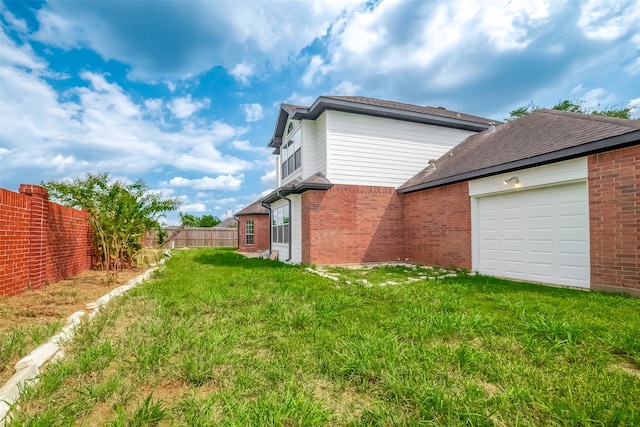 view of yard featuring a garage