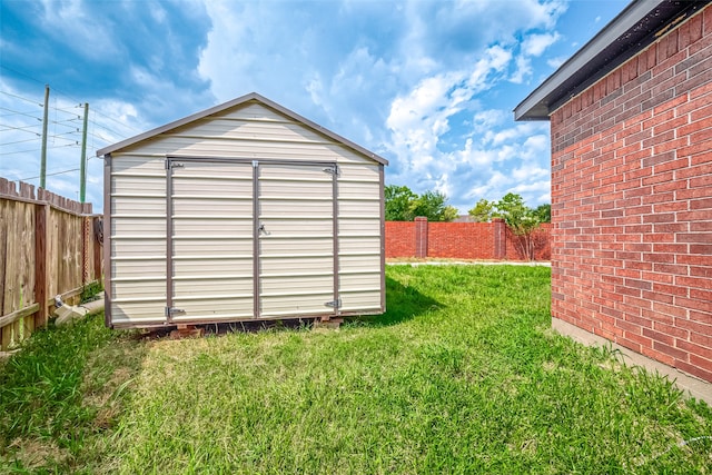 view of outbuilding featuring a yard