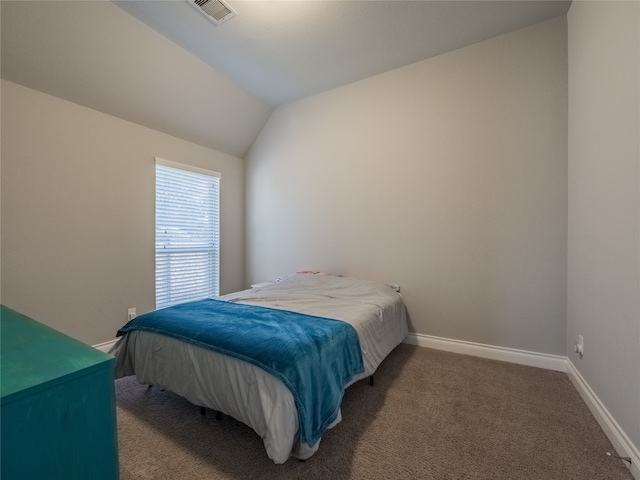 carpeted bedroom with vaulted ceiling