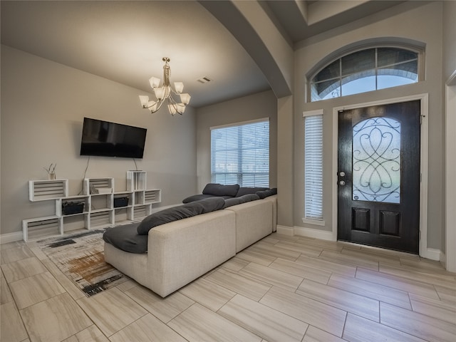 entryway featuring a notable chandelier