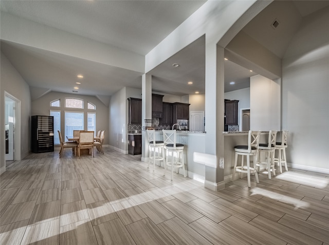 living room featuring vaulted ceiling