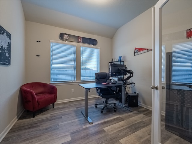 office space with wood-type flooring and lofted ceiling