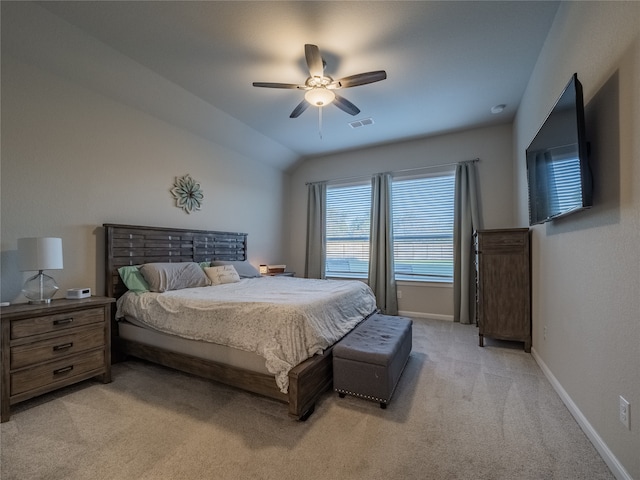 carpeted bedroom featuring vaulted ceiling and ceiling fan