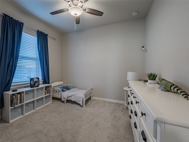 carpeted bedroom with ceiling fan