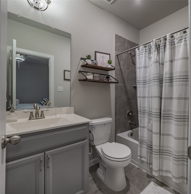 full bathroom featuring tile patterned flooring, vanity, toilet, and shower / bathtub combination with curtain