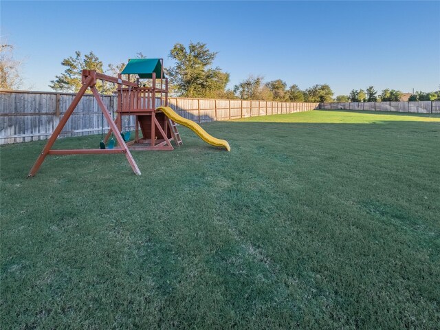 view of playground with a yard