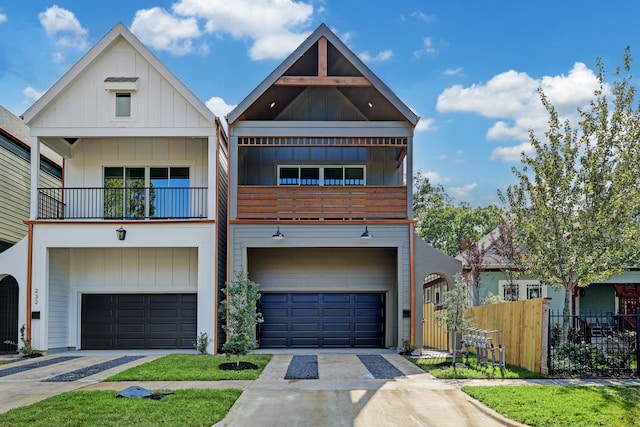 multi unit property featuring a garage and a balcony