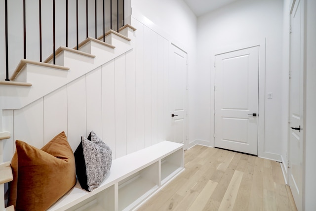 mudroom with light hardwood / wood-style floors