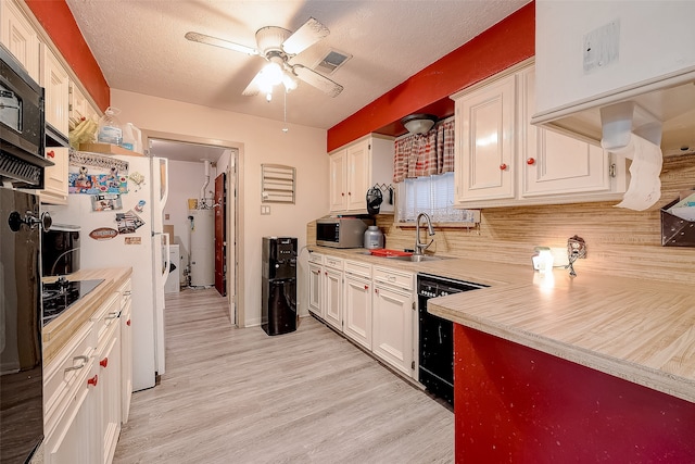 kitchen featuring black appliances, light hardwood / wood-style floors, white cabinets, and sink