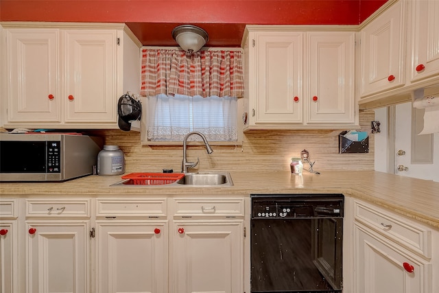 kitchen with dishwasher, backsplash, white cabinetry, and sink