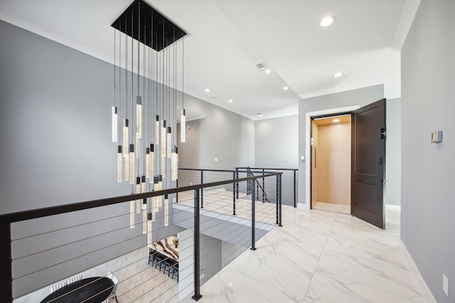 hallway with elevator and ornamental molding