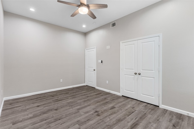 spare room featuring ceiling fan and hardwood / wood-style flooring