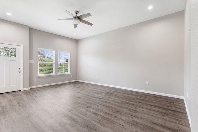 entryway with dark hardwood / wood-style flooring and ceiling fan