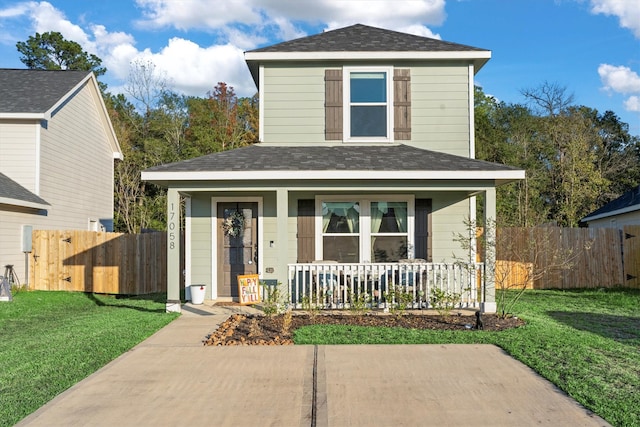 view of front property featuring a porch and a front yard