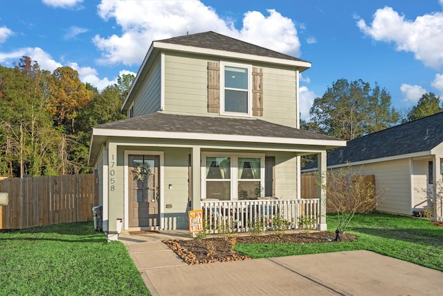 front facade with a front lawn and a porch