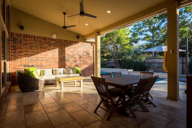 view of patio with outdoor lounge area and ceiling fan