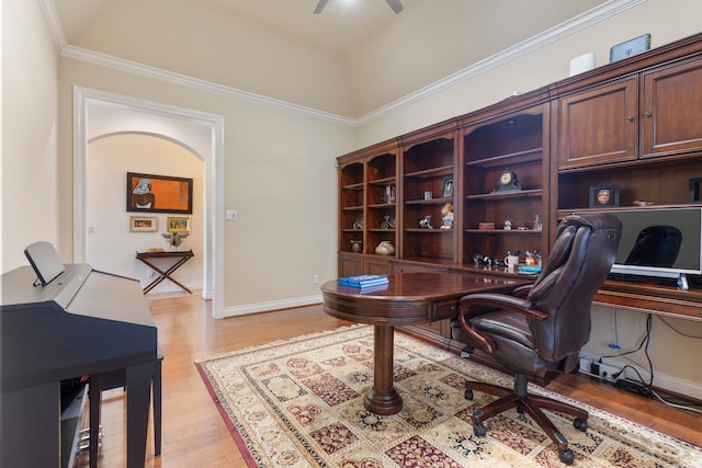 home office featuring ceiling fan, light hardwood / wood-style flooring, and ornamental molding