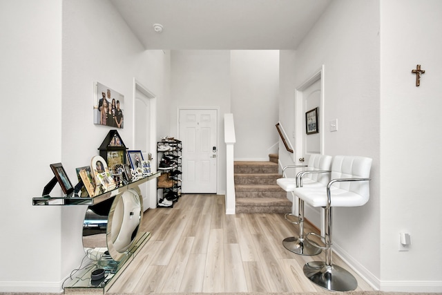 foyer entrance with light wood-type flooring