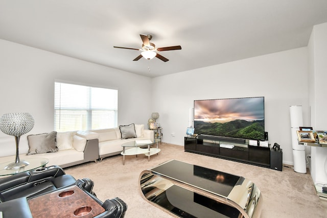 carpeted living room featuring ceiling fan