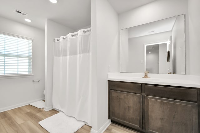 bathroom featuring wood-type flooring and vanity