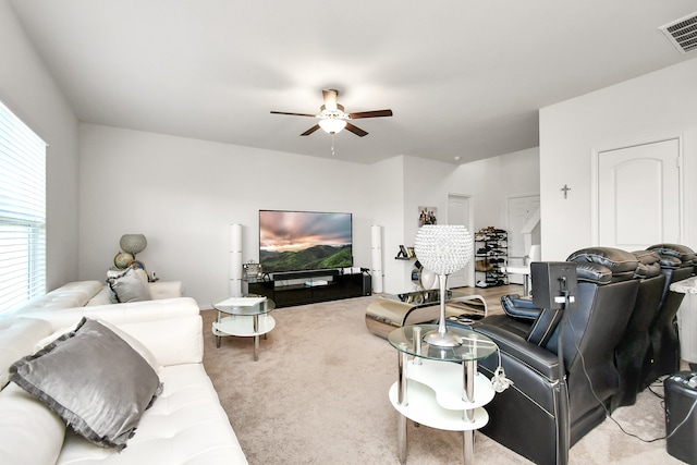 carpeted living room featuring ceiling fan