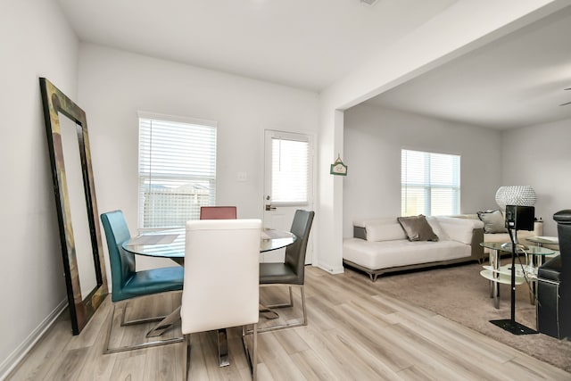 dining area featuring ceiling fan and light hardwood / wood-style floors