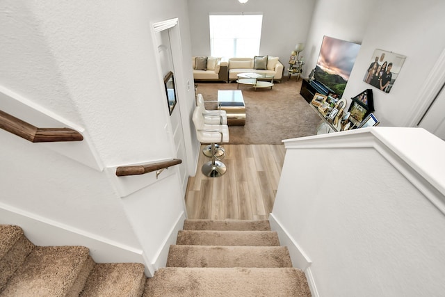 stairway featuring hardwood / wood-style floors