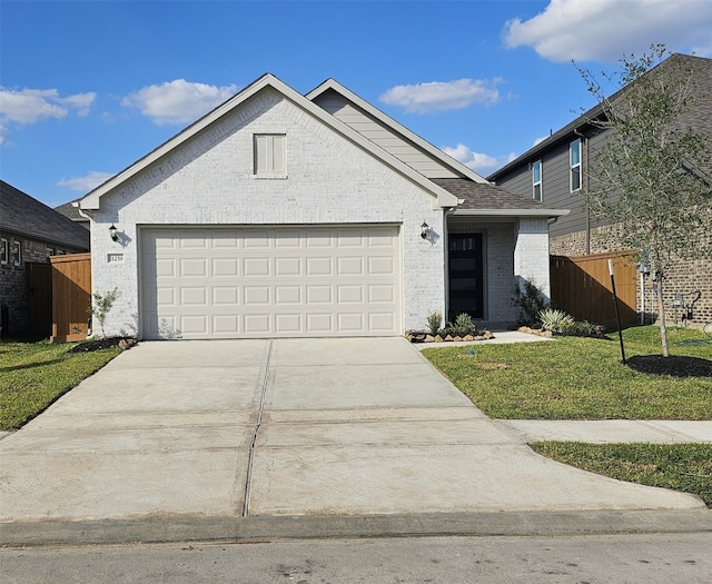 view of front facade with a front lawn and a garage